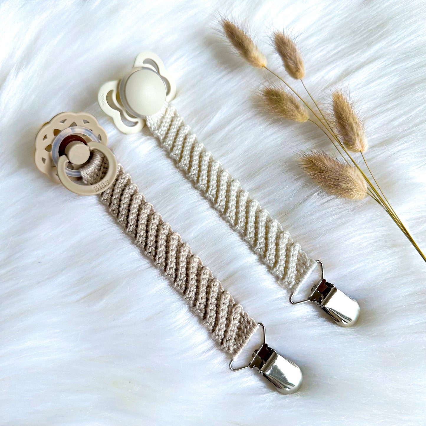 Modern crochet baby accessory pattern featuring a textured pacifier clip for handmade baby essentials.