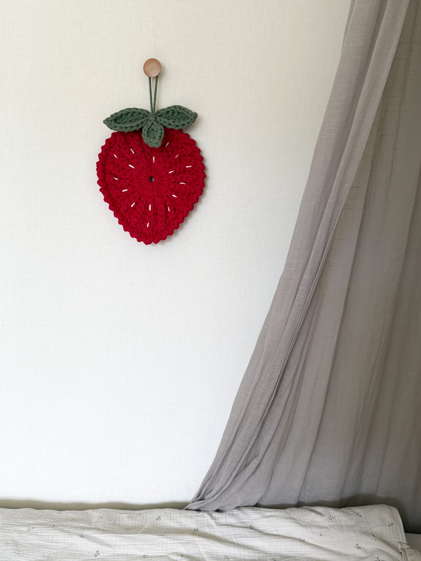 Minimalist crochet strawberry decoration pattern for kids room or nursery