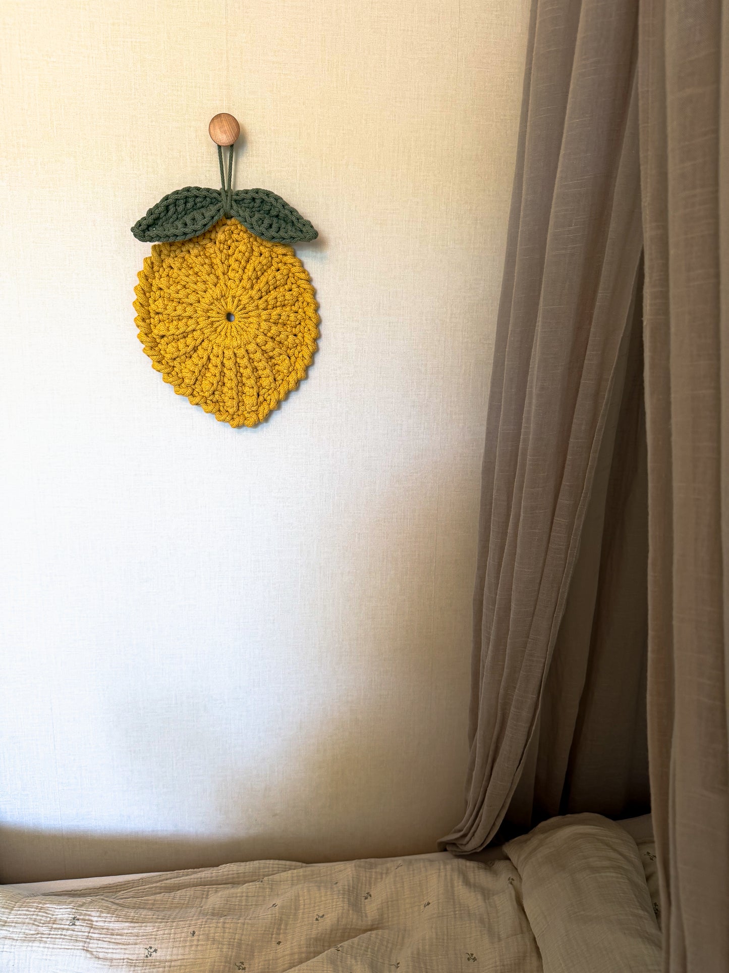 Minimalist crochet lemon decoration pattern for kids room or nursery