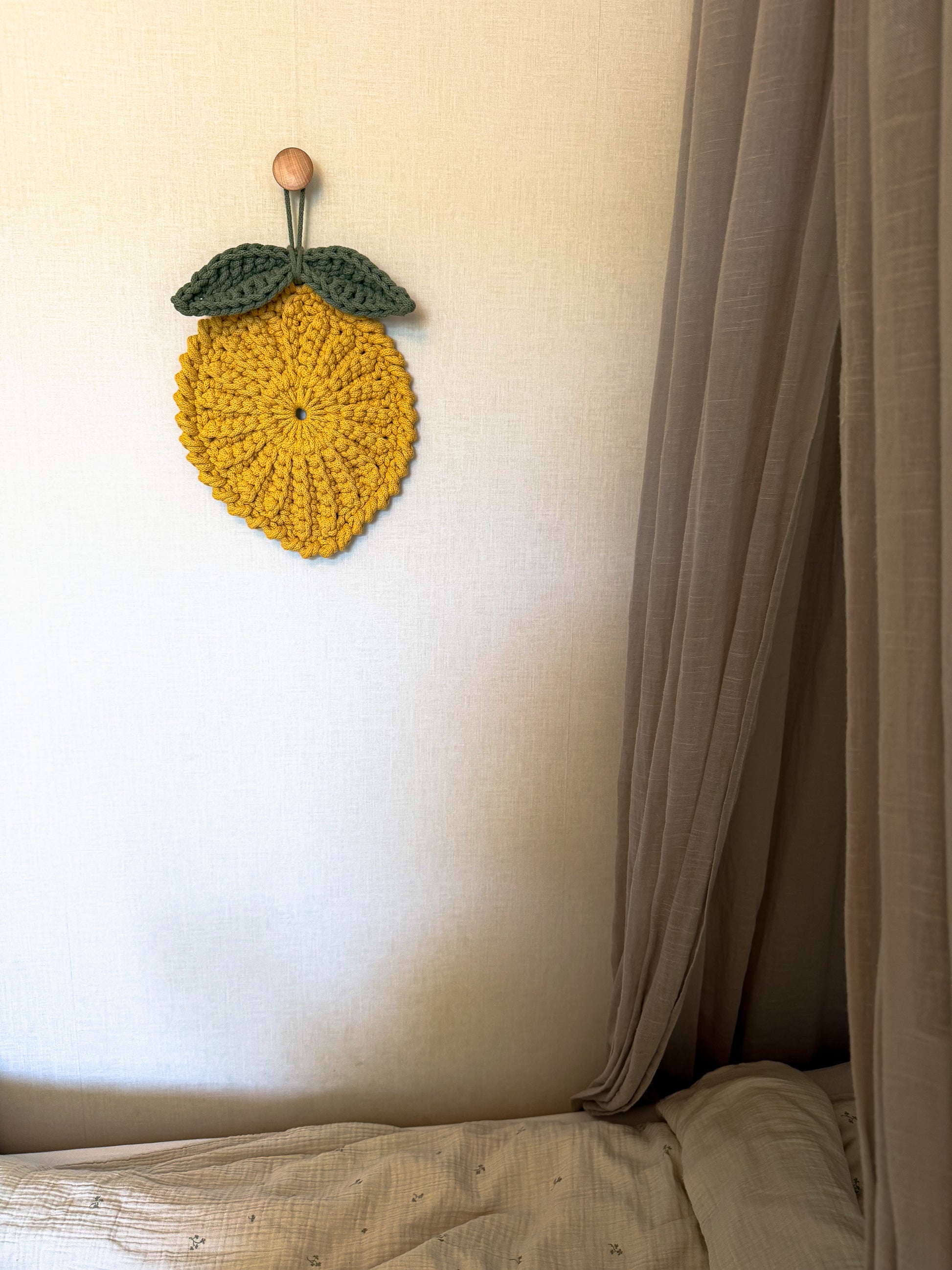 Minimalist crochet lemon decoration pattern for kids room or nursery