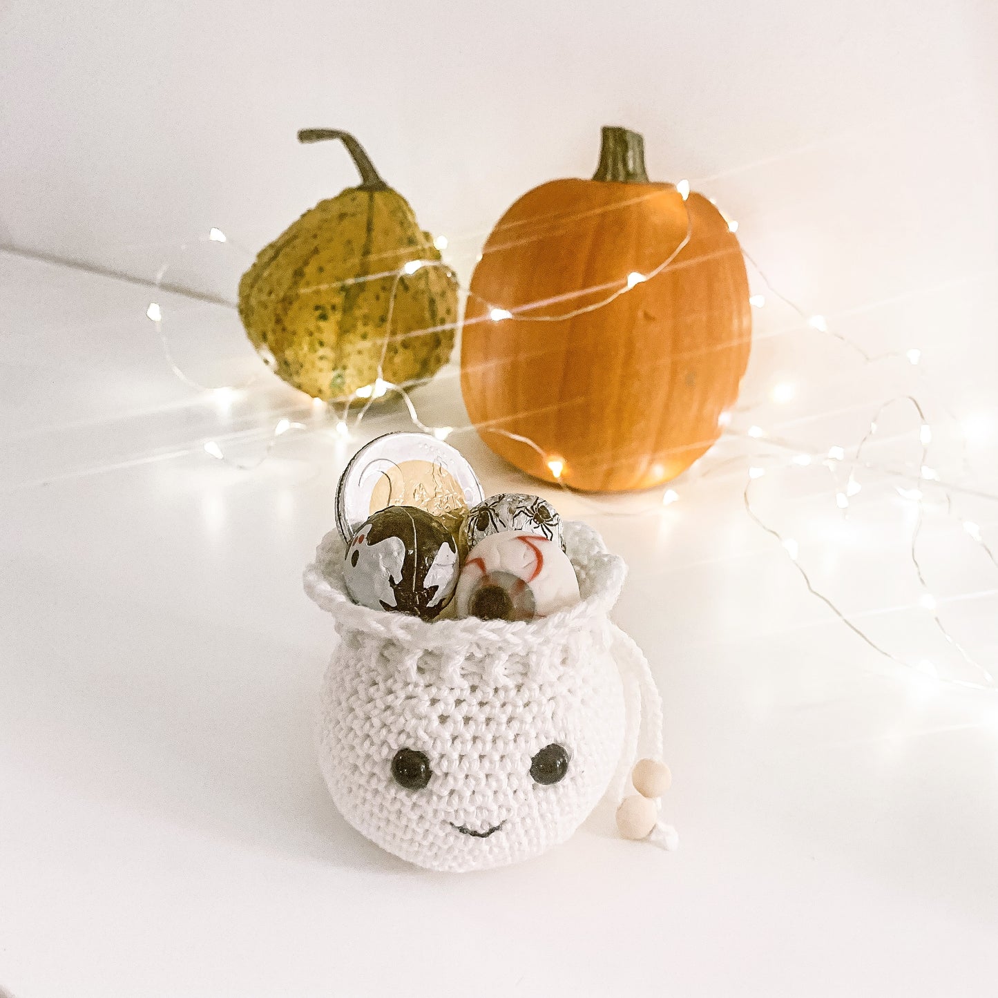 Crochet fall gift bag pattern designed for Halloween treats, handmade gifts, and autumn home decor.