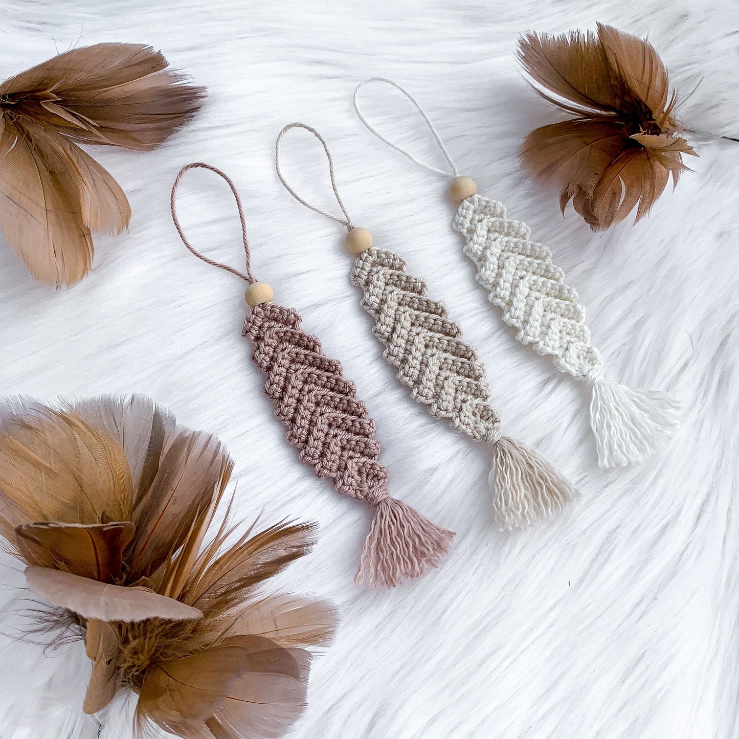 Crochet feather ornament pattern designed for handmade Easter branches and spring decor.