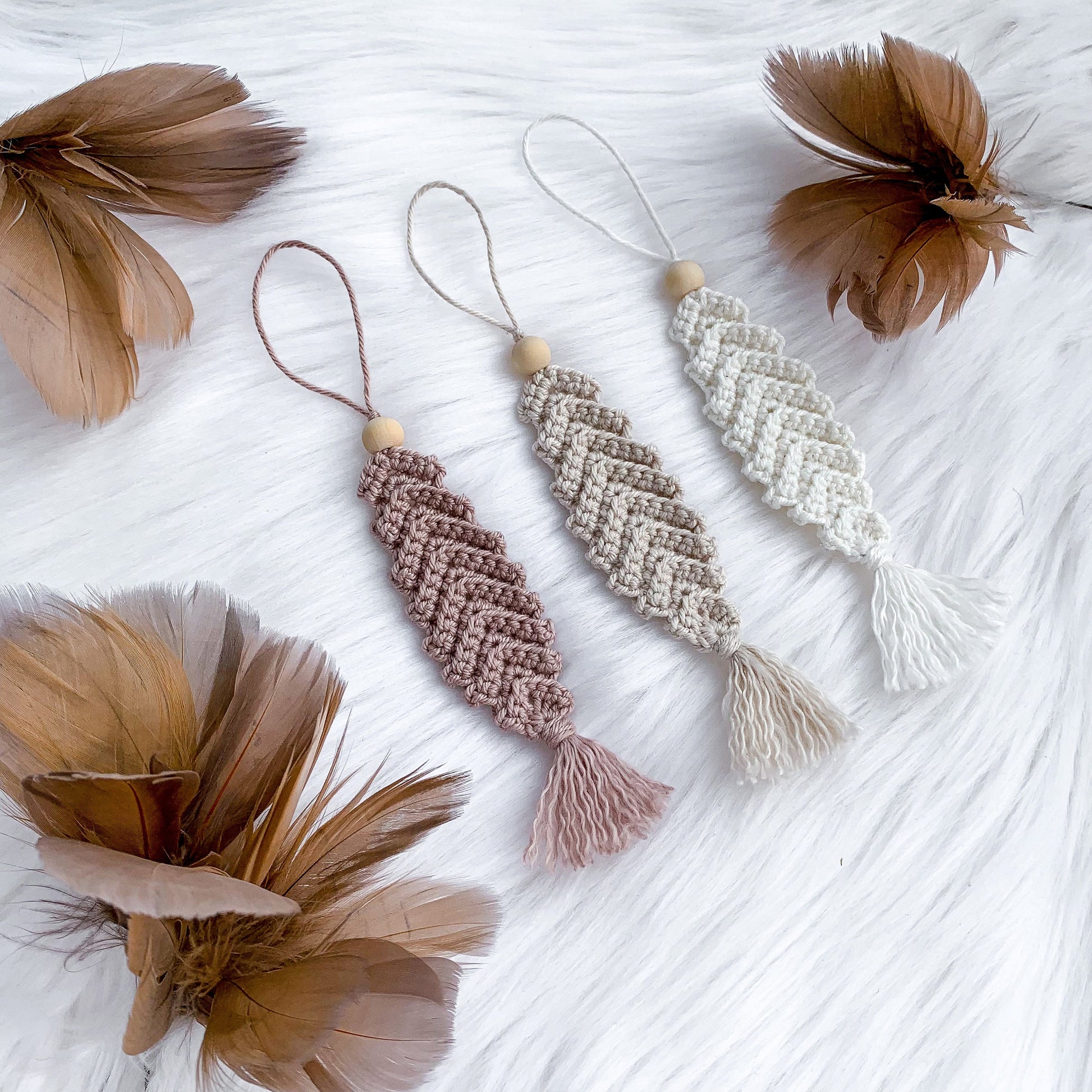 Crochet feather ornament pattern designed for handmade Easter branches and spring decor.