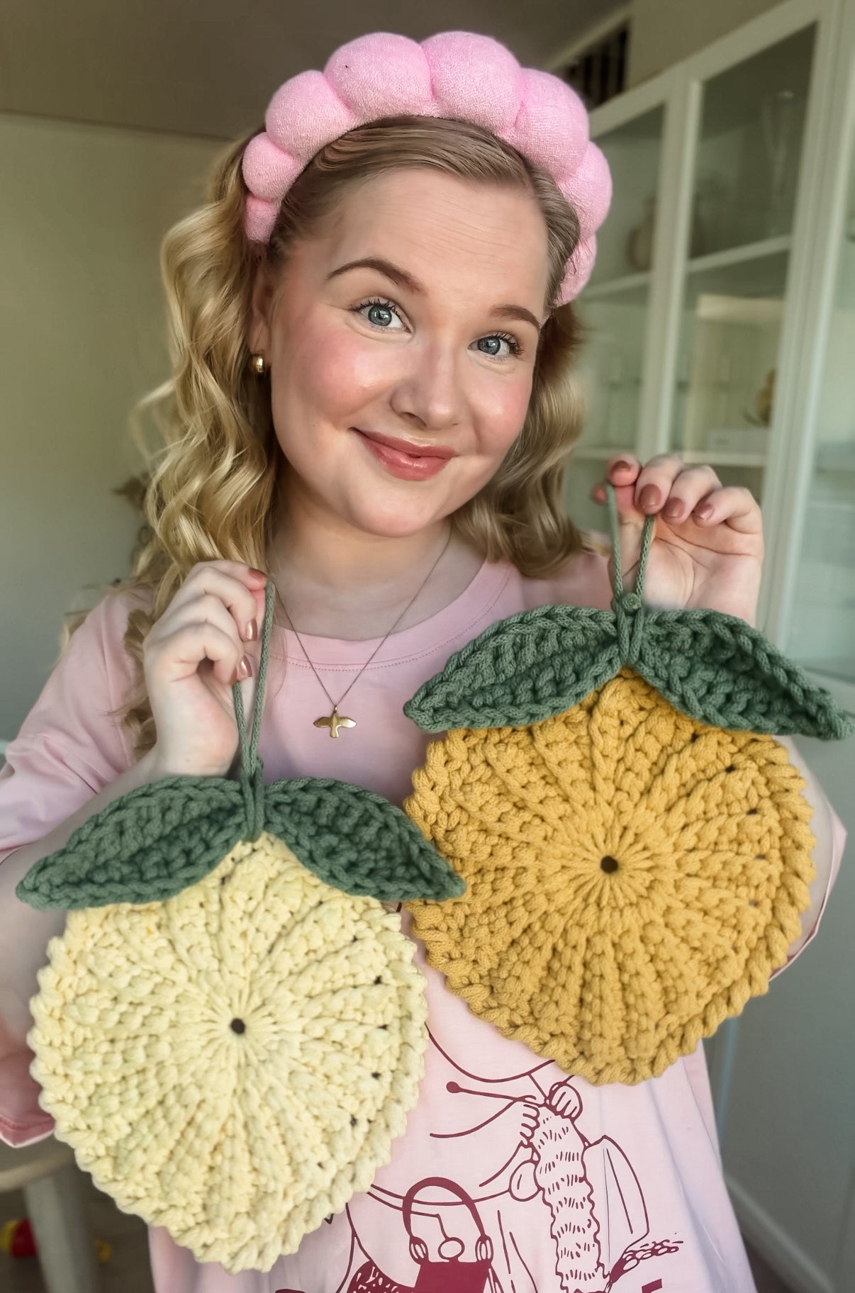 Easy crochet lemon gift pattern for handmade presents. Original designer from Animo Design holding it.