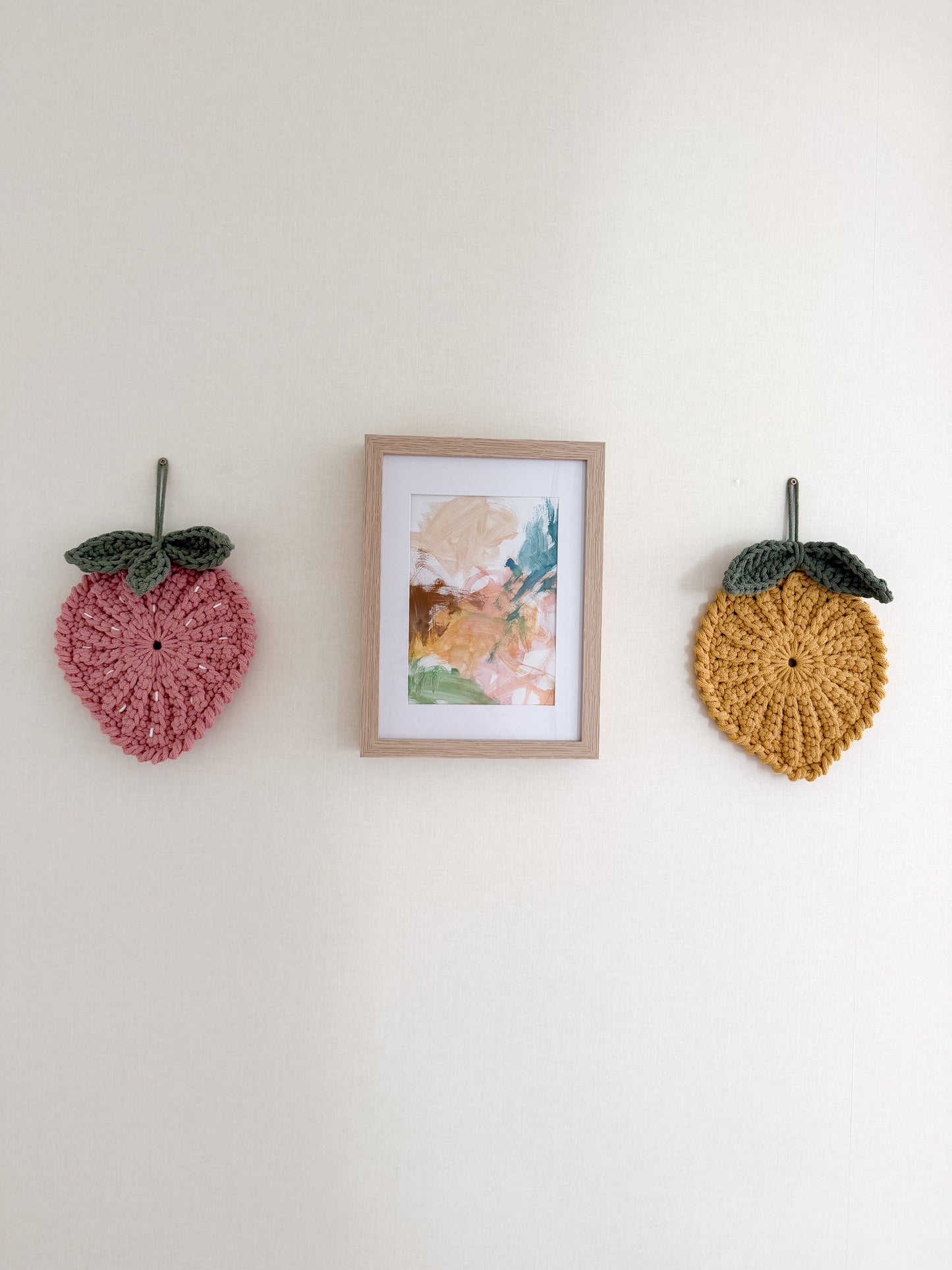 Crochet strawberry and lemon wall decoration