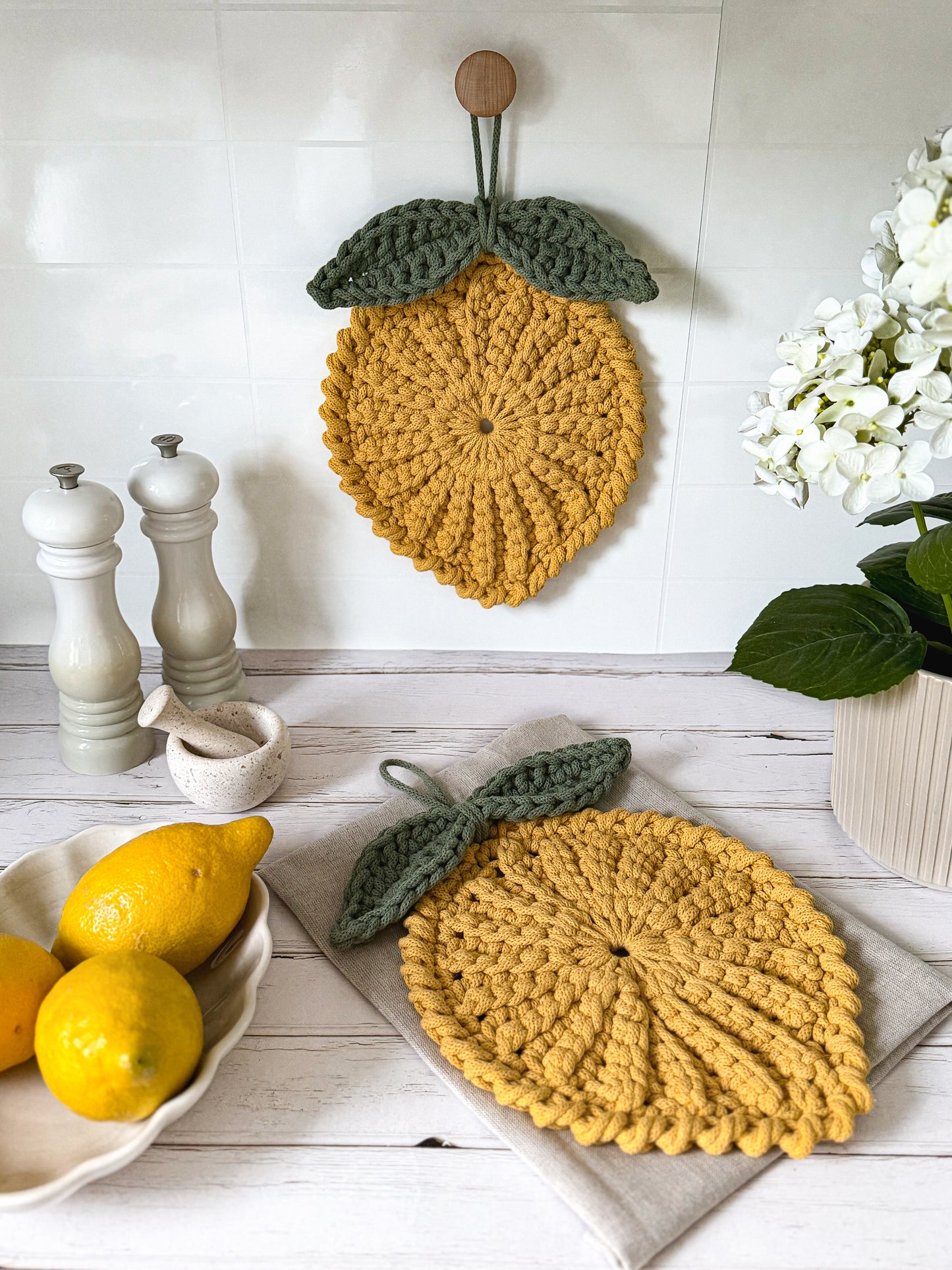 Crochet lemon coaster and trivet pattern for kitchen styling. Designed by Malin Fredriksson from Animo Design. 