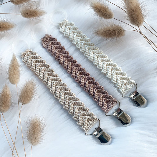 Crochet pacifier clip pattern Freja with Scandinavian-inspired handmade baby styling and soft neutral colors.