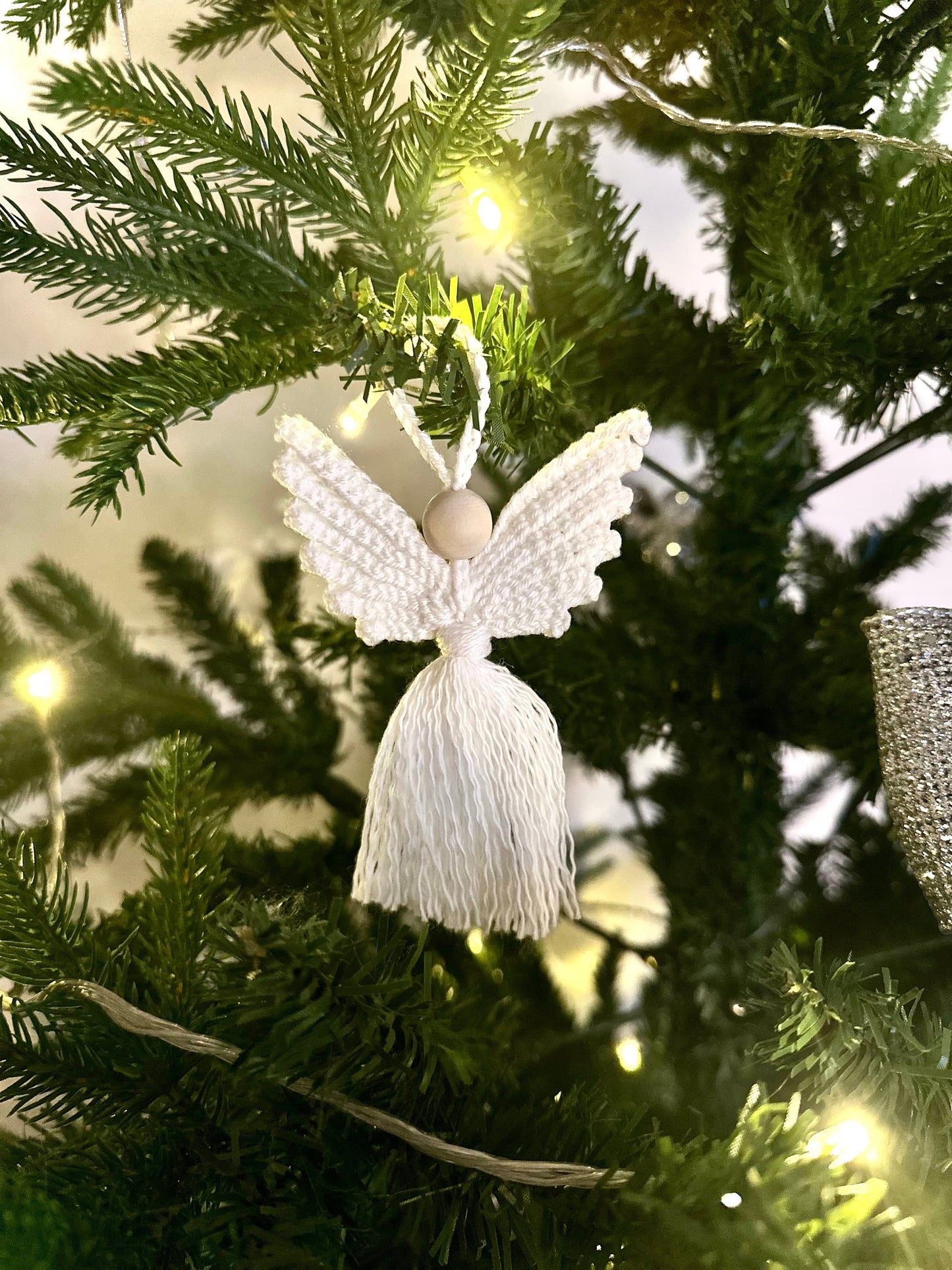 Handmade crochet angel decoration pattern with textured details and Scandinavian-inspired Christmas aesthetic.