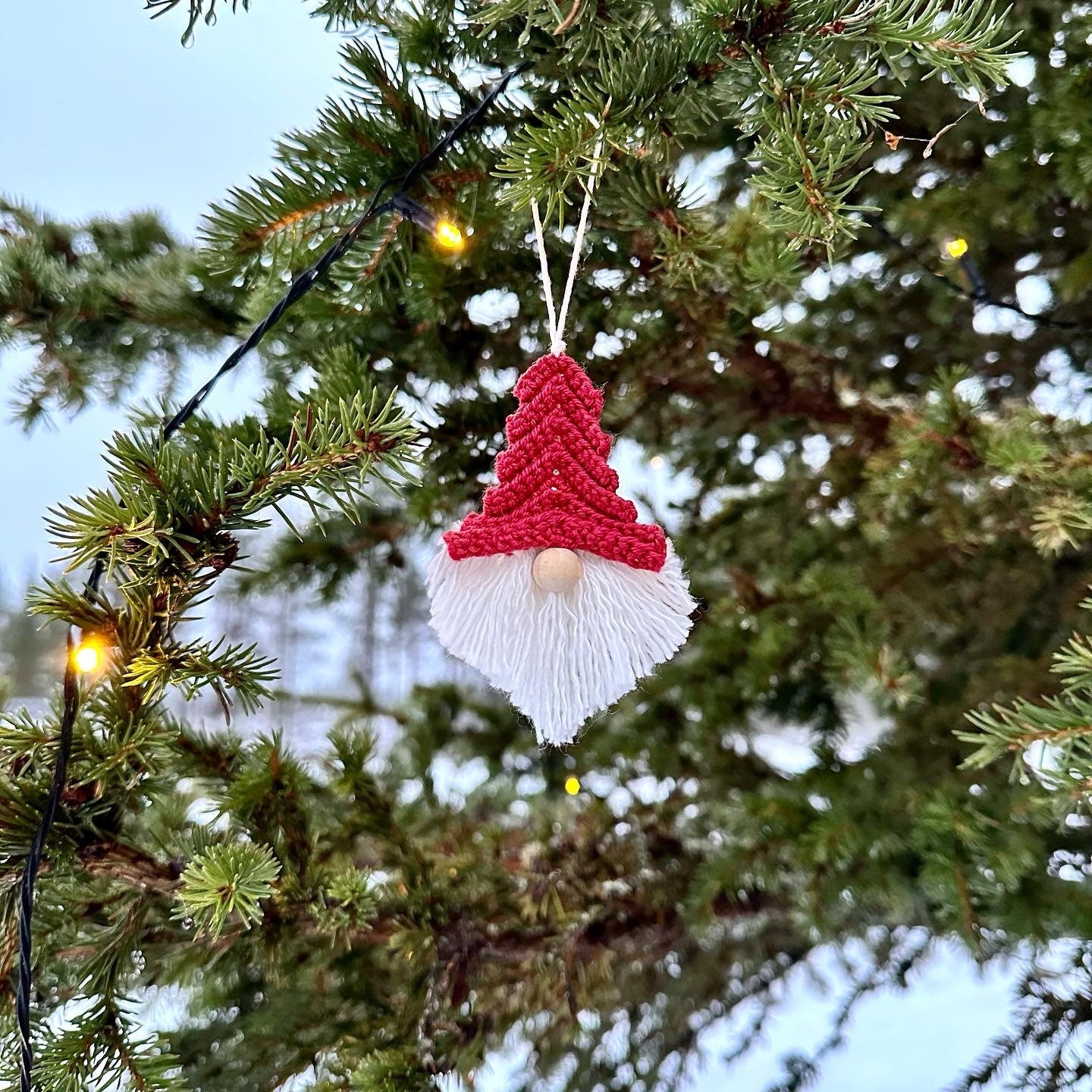 Handmade crochet Christmas decoration pattern featuring a textured Scandinavian-inspired gnome design.