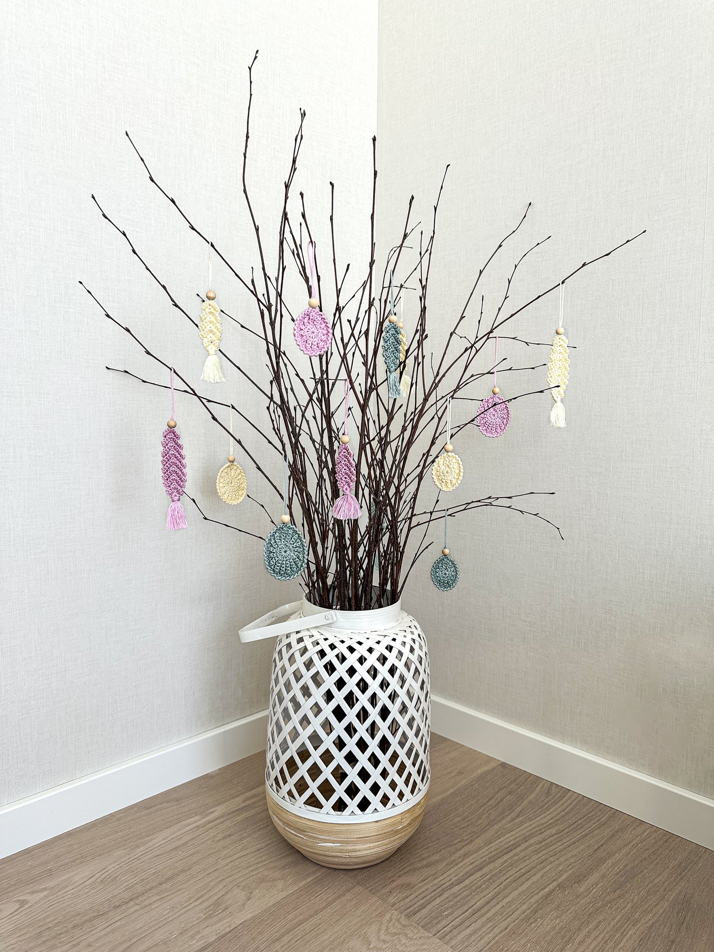 Handmade crochet spring ornament pattern with textured Easter egg design and soft neutral colors.