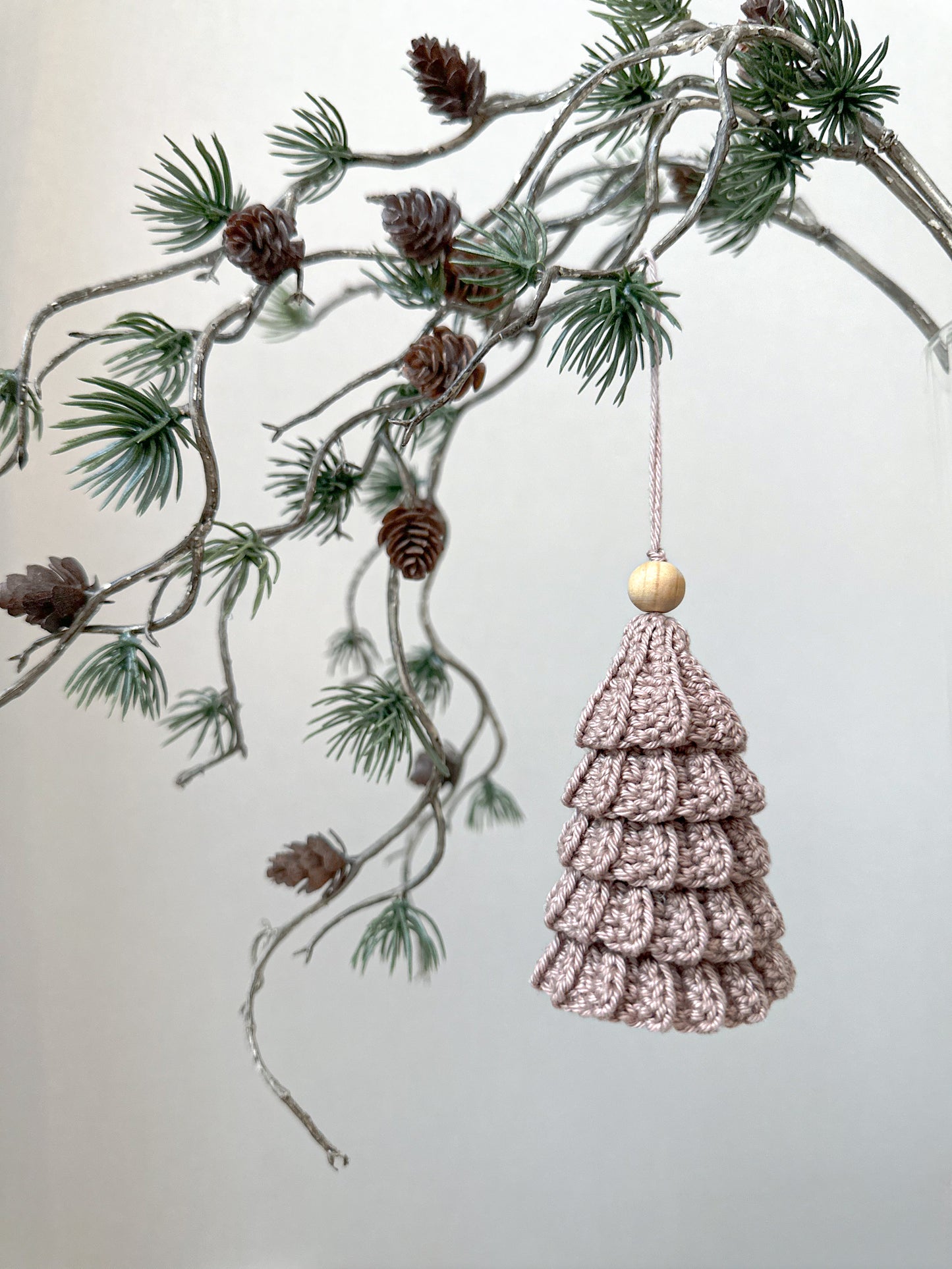 Modern crochet Christmas tree pattern for Scandinavian-inspired holiday decor and handmade festive ornaments.
