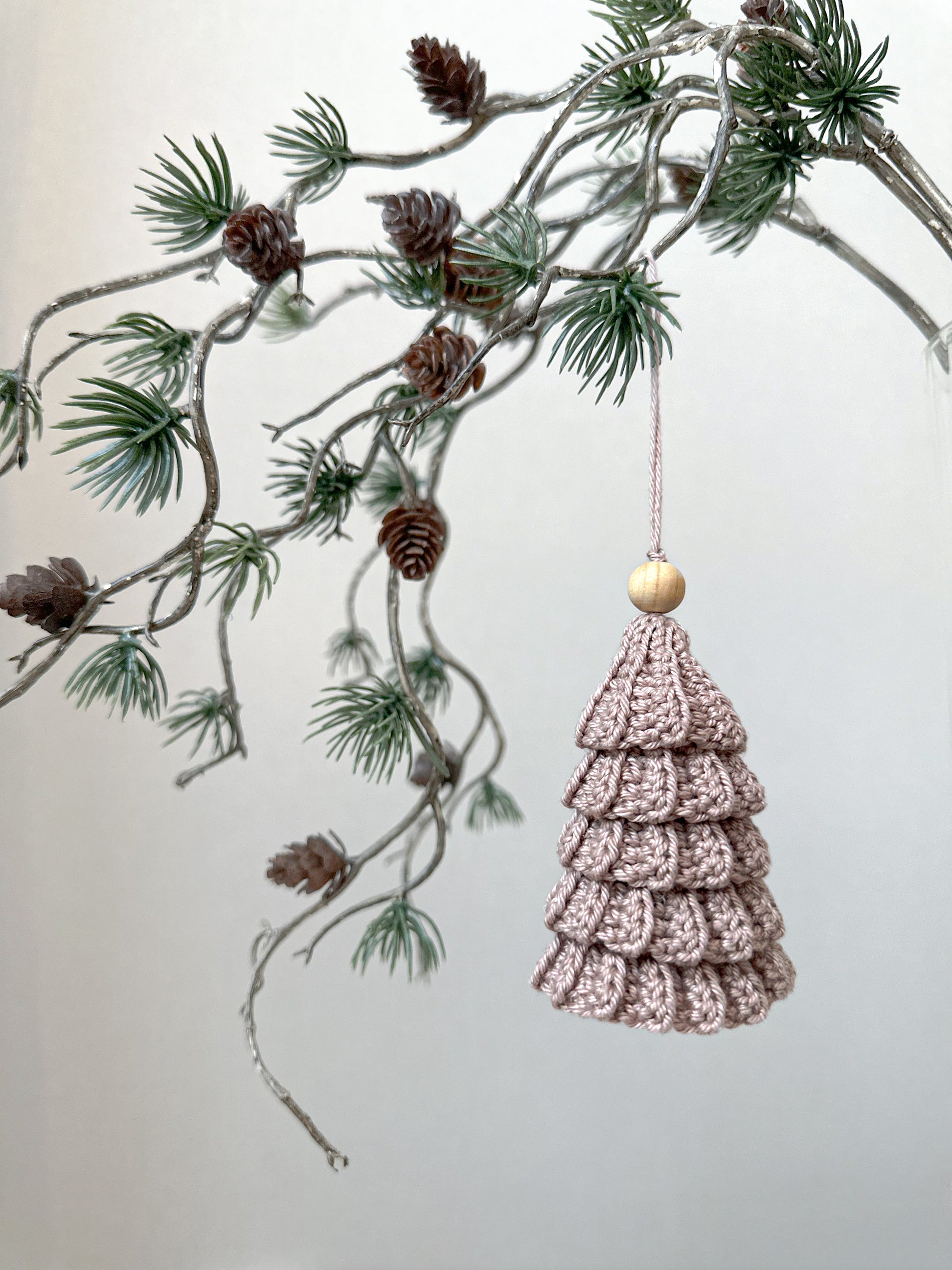 Modern crochet Christmas tree pattern for Scandinavian-inspired holiday decor and handmade festive ornaments.