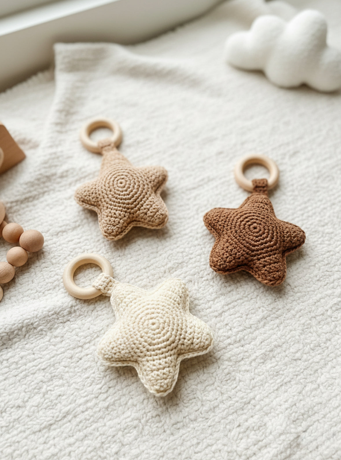 Neutral crochet baby rattle pattern with soft textures and cozy handmade nursery aesthetic.
