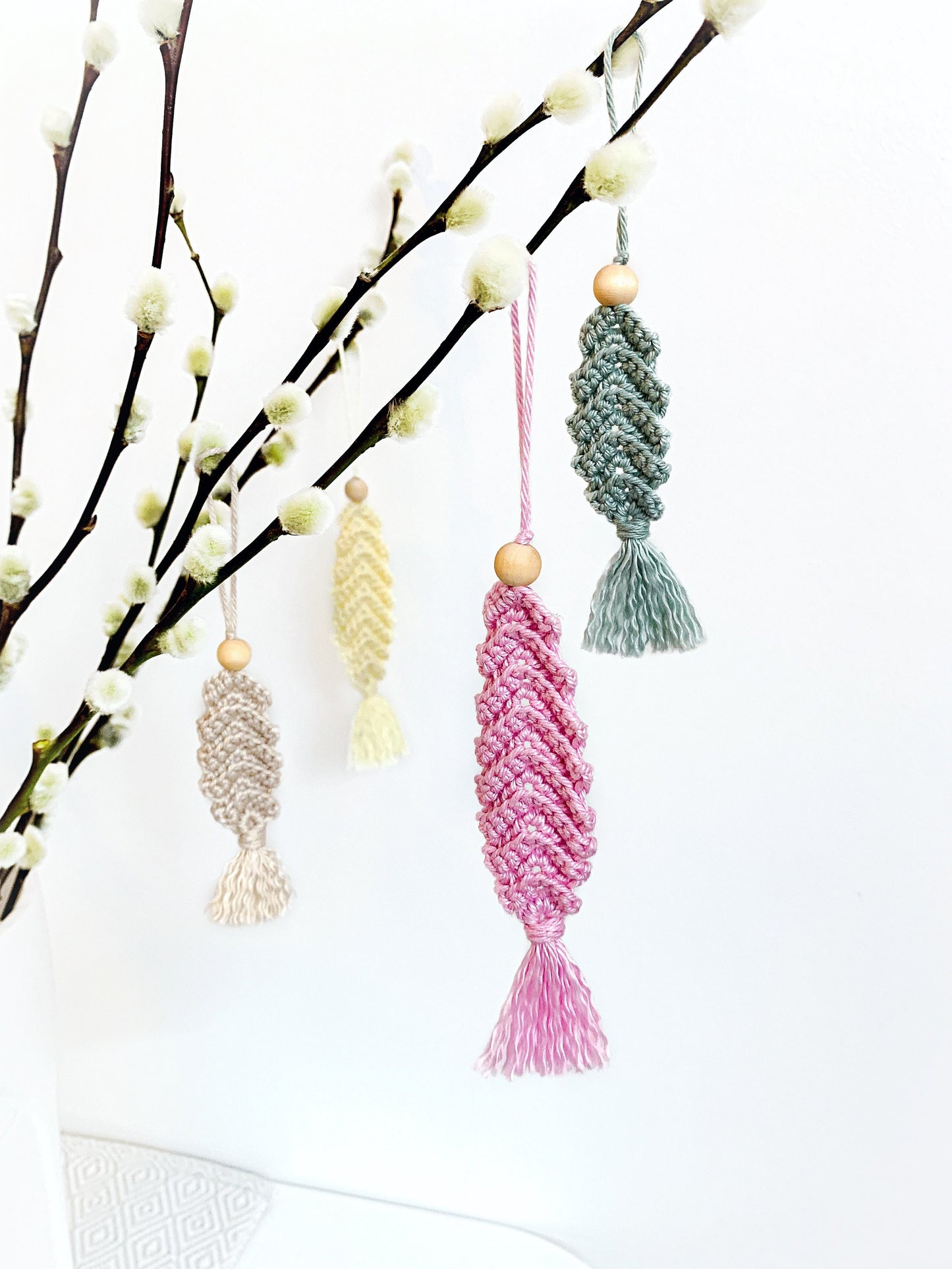 Neutral crochet Easter decor pattern with elegant feather-inspired handmade ornament styling.