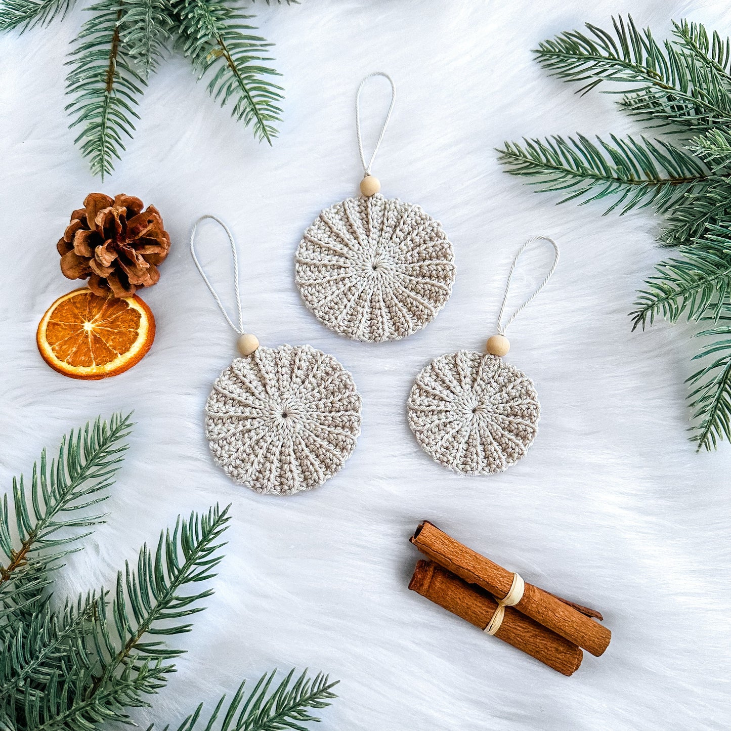 Handmade crochet Christmas decoration pattern with textured ornament design and Scandinavian styling.