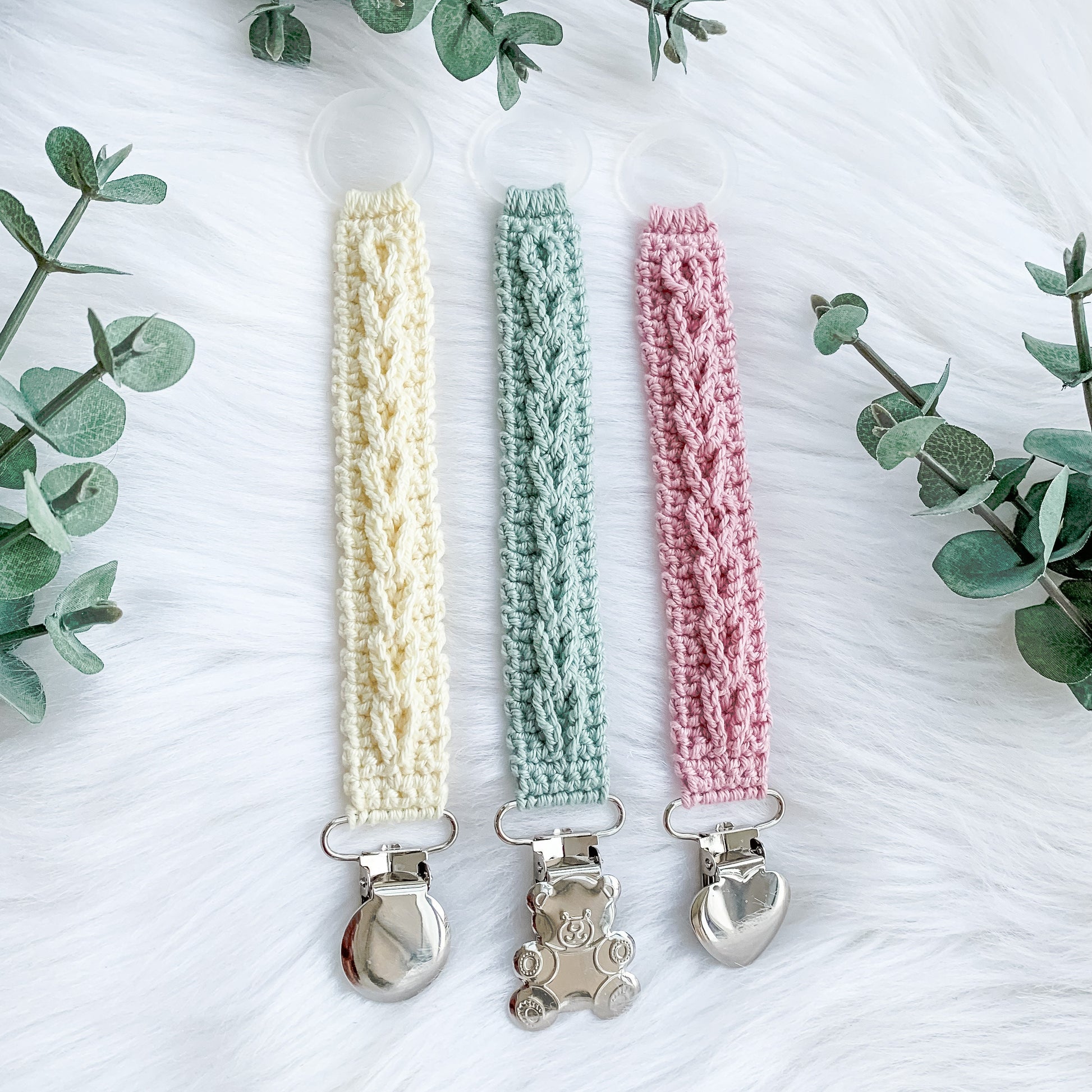 Neutral crochet pacifier clip pattern designed for minimalist baby accessories and modern nursery decor.