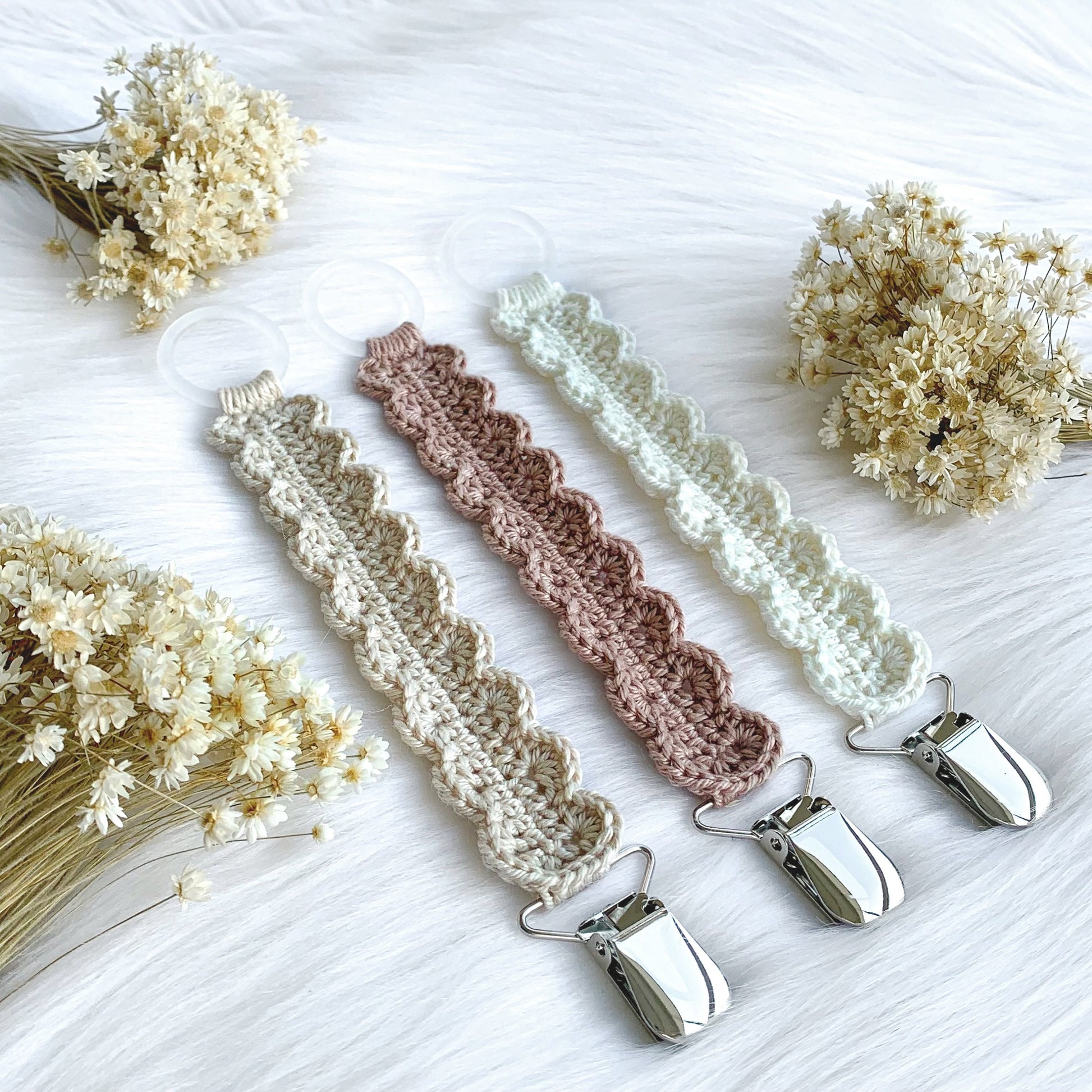 Neutral crochet pacifier clip pattern designed for minimalist baby accessories and modern nursery decor.