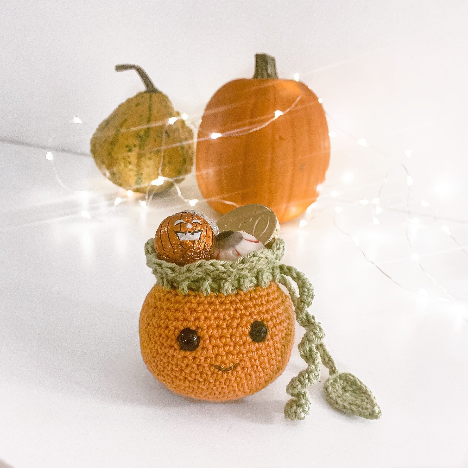 Scandinavian crochet Halloween decor pattern with neutral colors and handmade seasonal aesthetic.