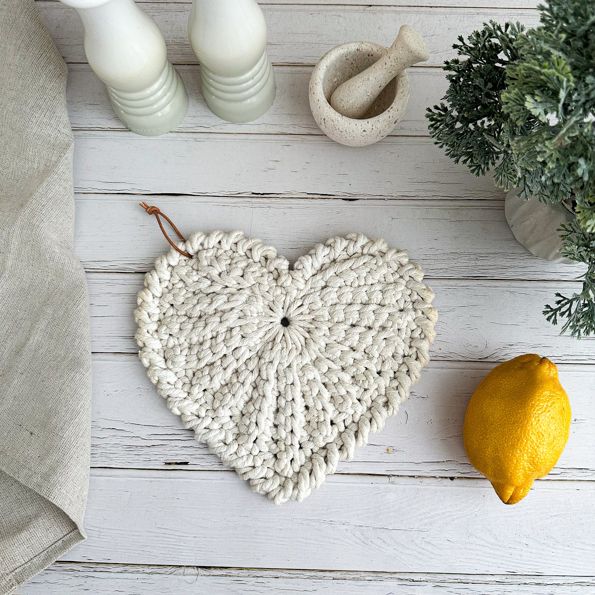 Scandinavian crochet heart decor pattern with minimalist neutral aesthetic.