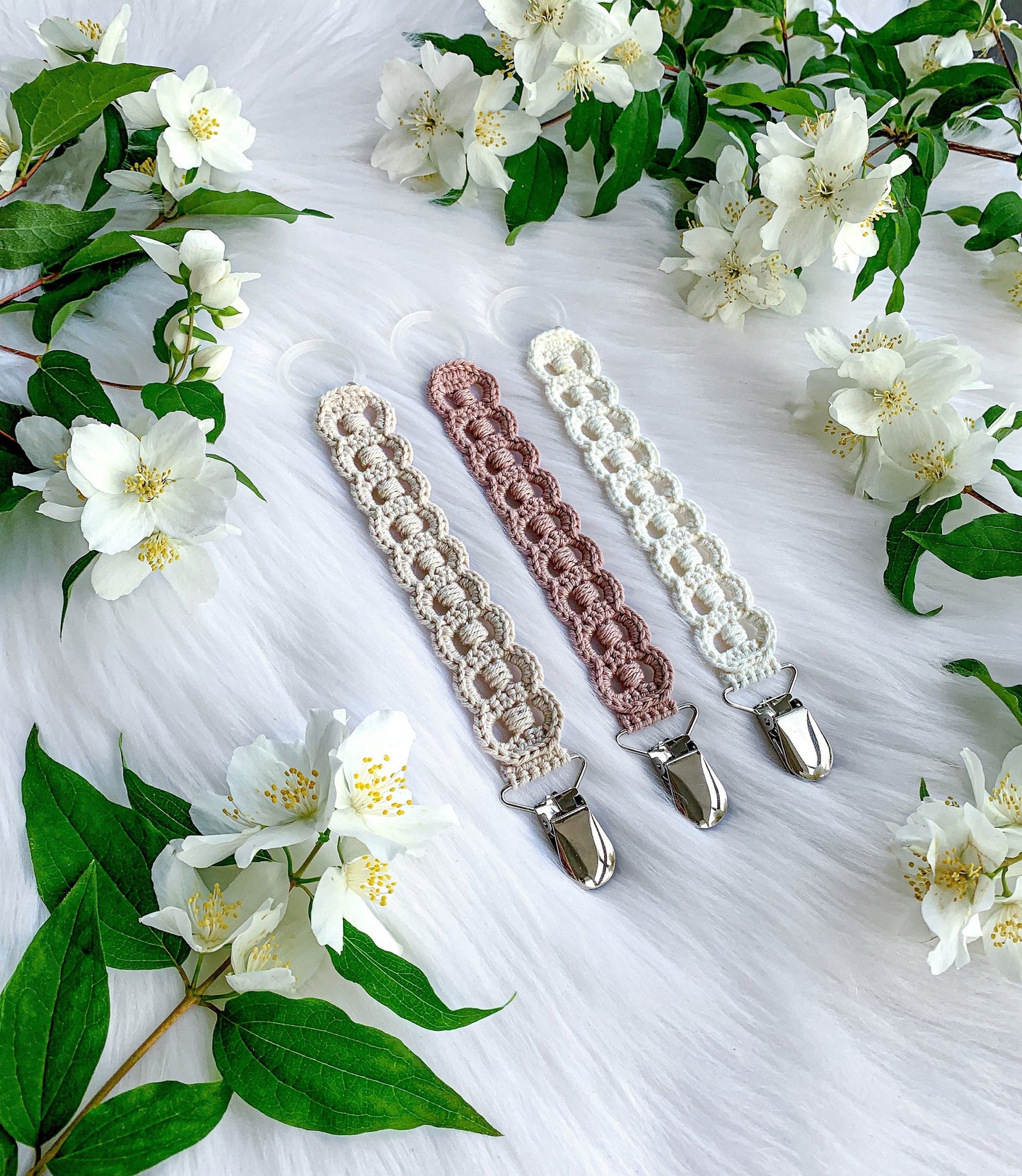 Scandinavian crochet pacifier clip pattern with minimalist handmade baby accessory design and cozy textures.